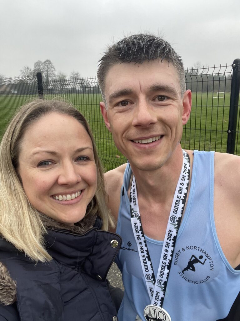 Runner and partner after finishing the Oundle 10k race
